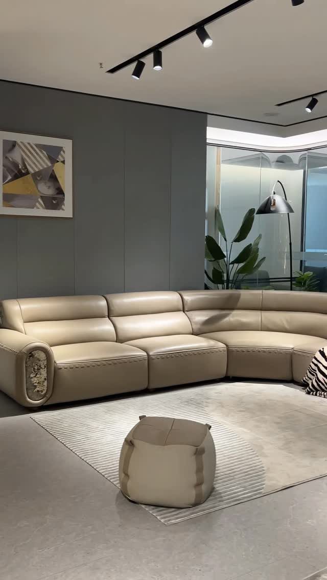 Leather Sofa Living Room Ideas: 8 Styles and Layouts 5 Beige leather sectional sofa in a modern living room with a matching ottoman.
