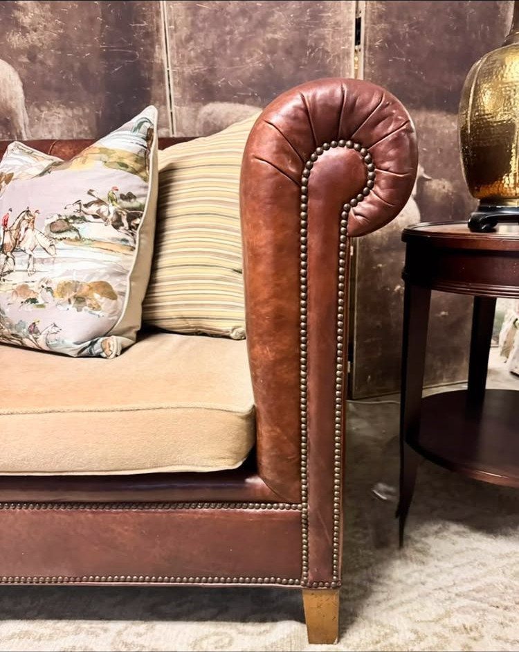 Leather Sofa Living Room Ideas: 8 Styles and Layouts 2 Brown leather Chesterfield sofa with rolled arm, nailhead trim, and decorative throw pillows.