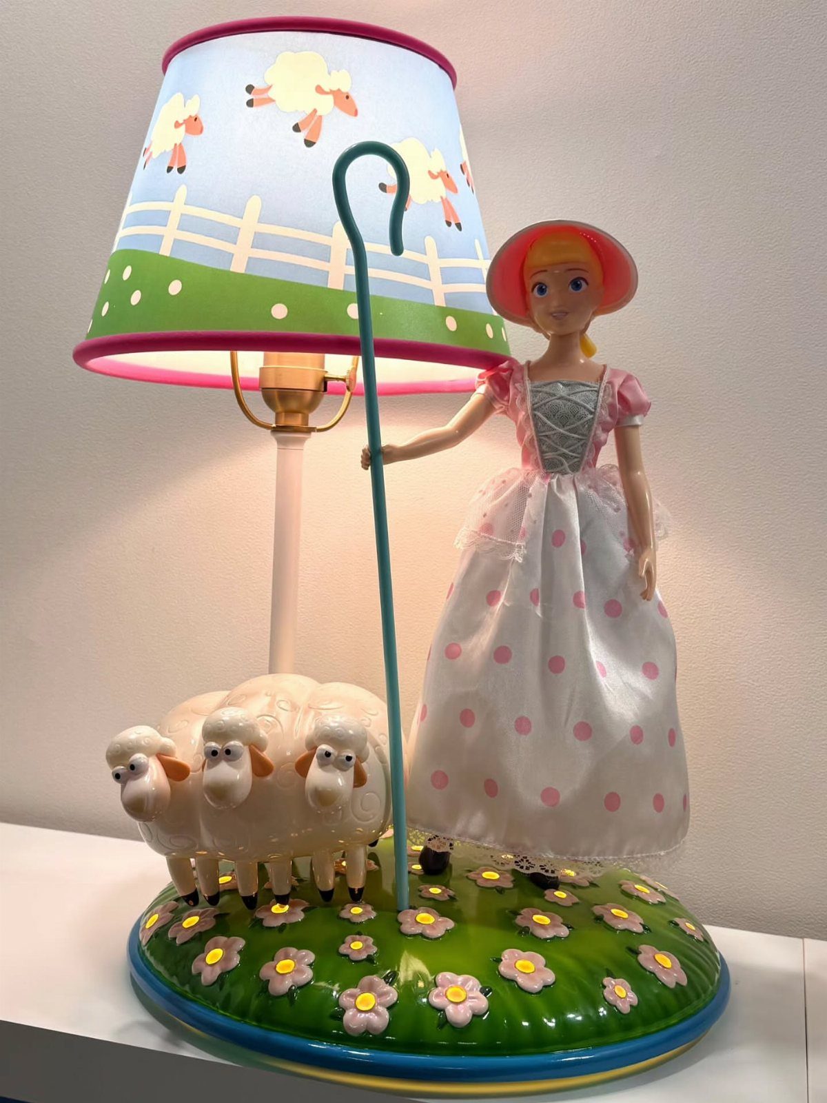 12 Toy Story Bedroom Ideas for Kids Who Love Woody and Buzz 6 Bo Peep and sheep themed lamp with a matching illustrated lampshade.